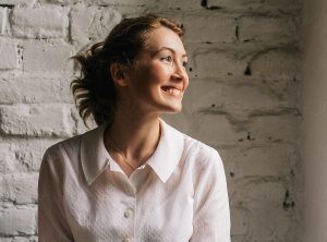 Training for Healthcare Professionals, Image of woman smiling out a window