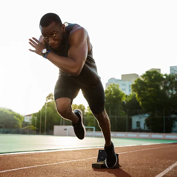 A man sprinting on a running track