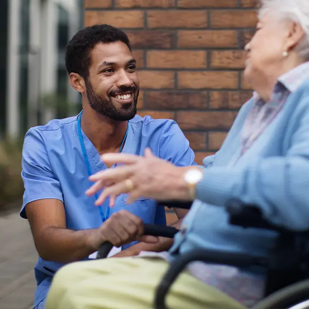 A nurse chatting with a patient